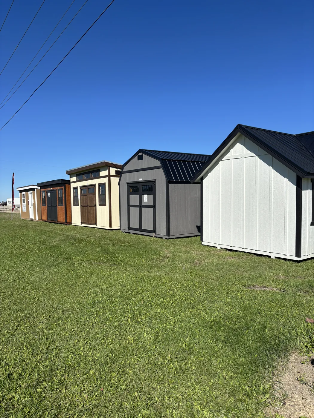 Row of Pine View sheds on display at Borderland Powersports, Portage la Prairie MB